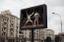 outdoor advertisement showing two fencers in action