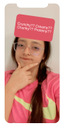 girl with glasses and a pink shirt in deep thought