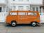 orange van promoting Etsy on its decals